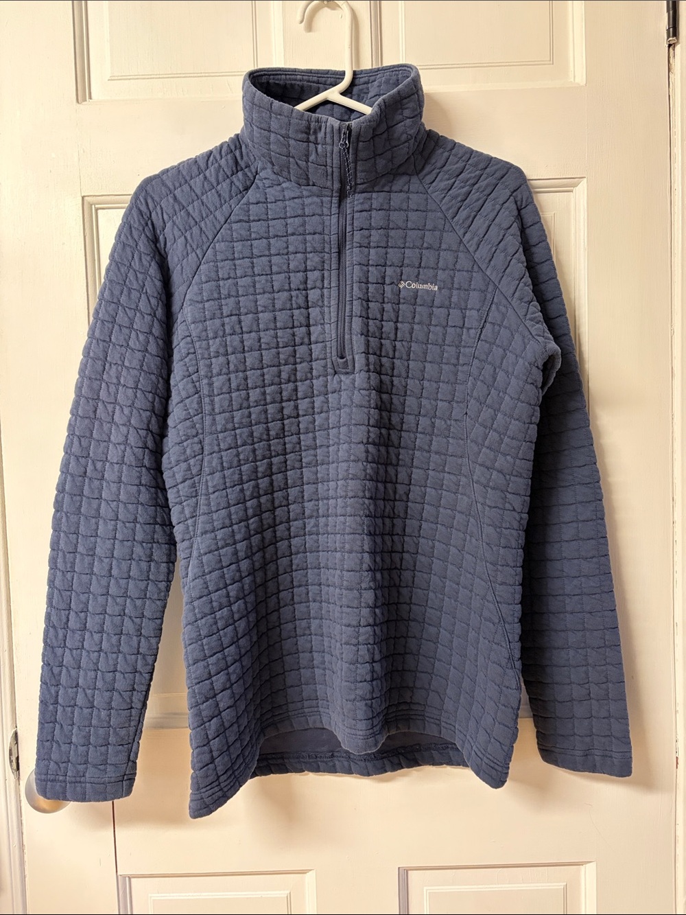 Columbia blue half-zip fleece pullover featuring a grid pattern women’s size M
